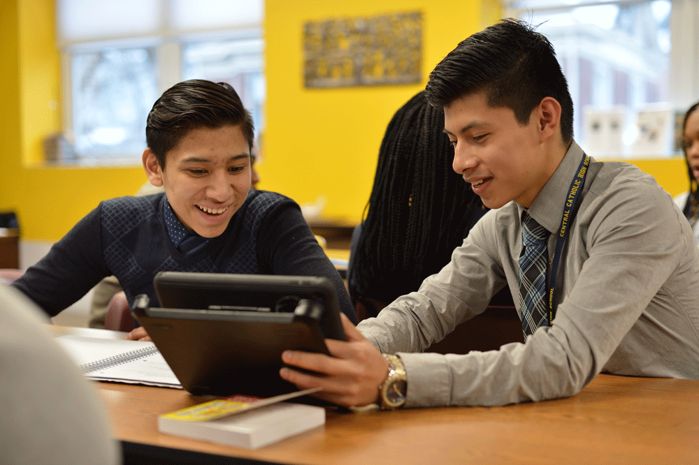 Two students looking at iPad together