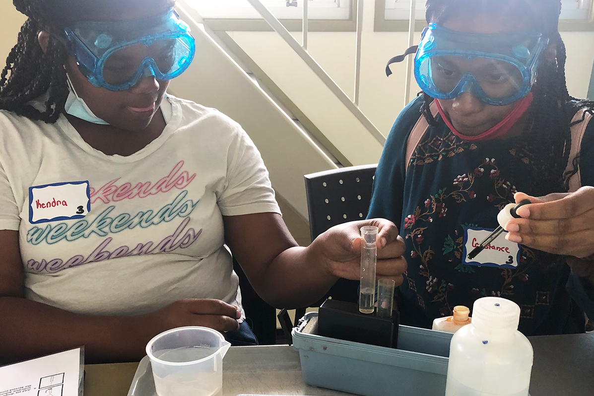 Crossroads scholars working with water samples during an on-site visit with Rivers of Steel.